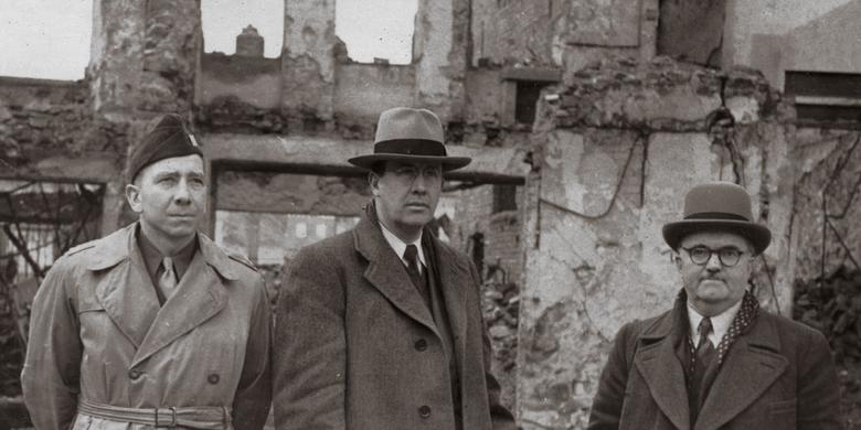 Ezra Taft Benson and others inspect damage in Freiberg, Germany, after World War II
